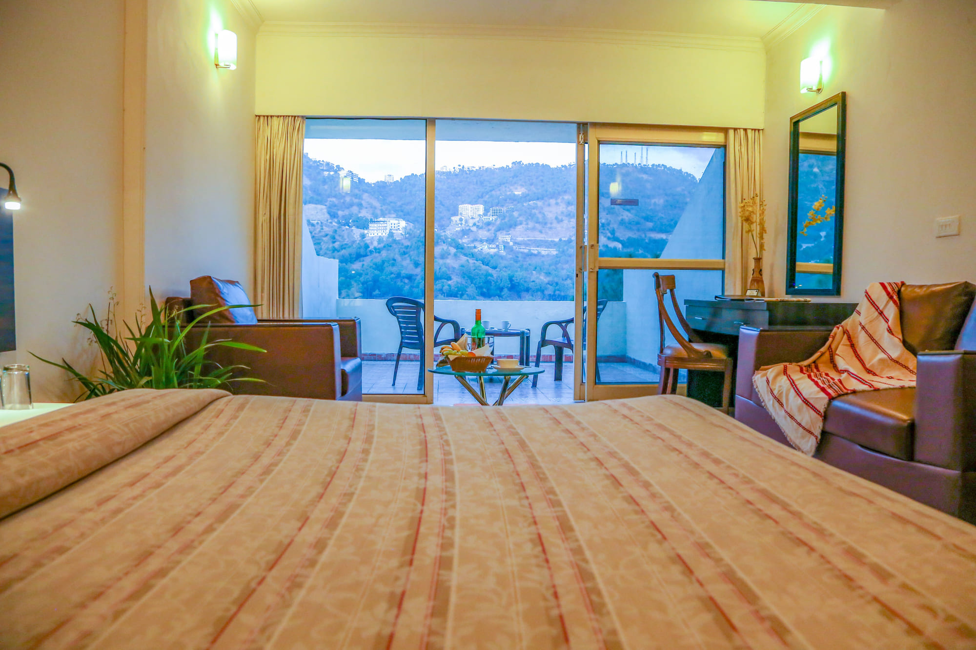 Looking from the bed through sliding doors onto a balcony