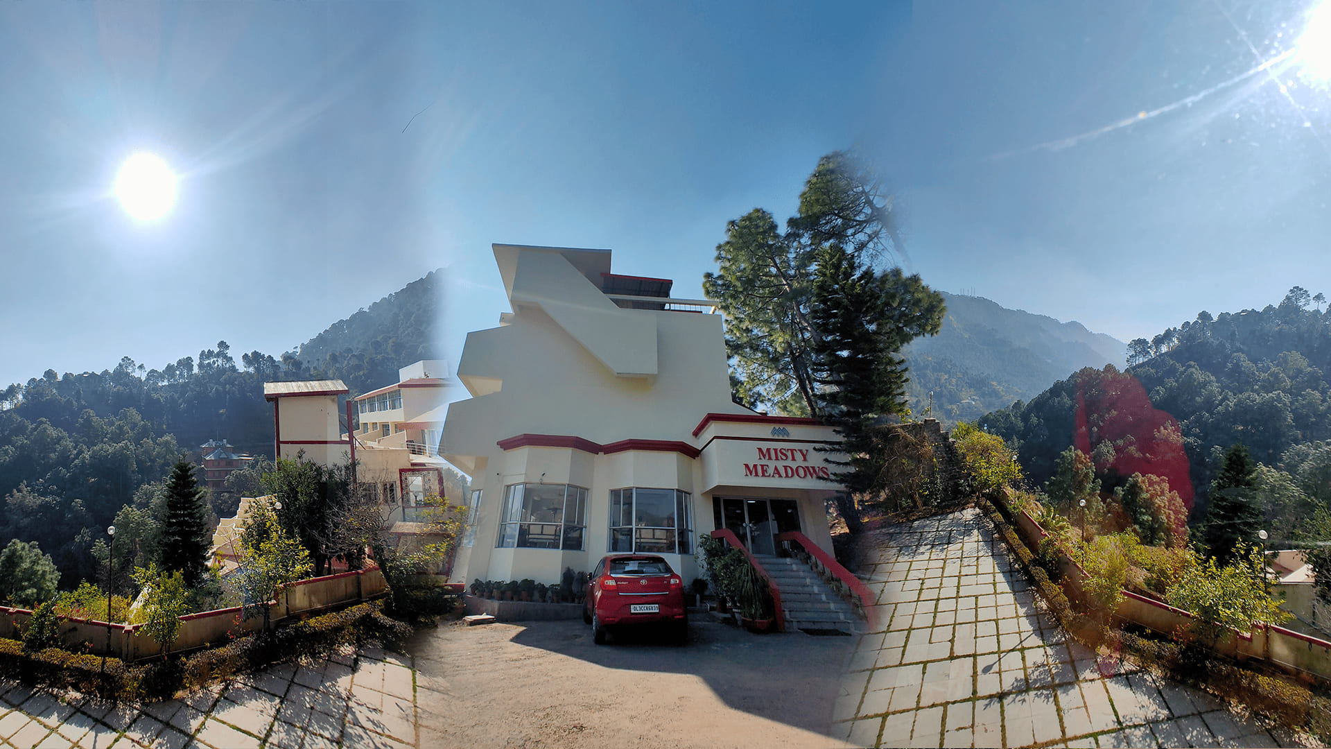 The entrance forecourt at Misty Meadows Resorts in full sun