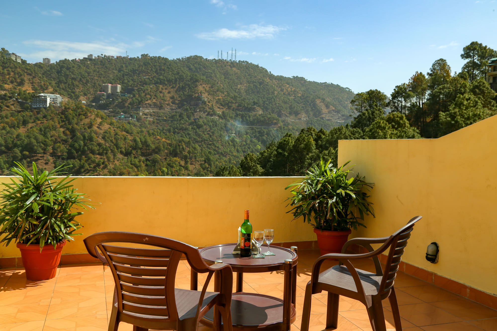 A table for two on a private terrace looking down the valley
